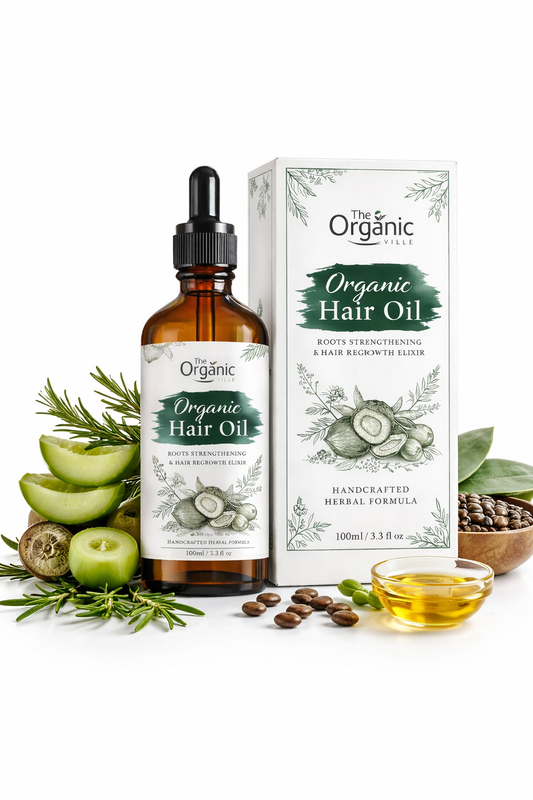 Organic hair oil bottle and packaging with herbs and apples on a white background
